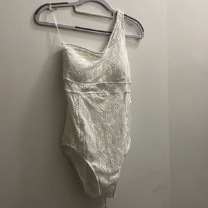 Becca color play asymmetrical one-piece swimsuit in white